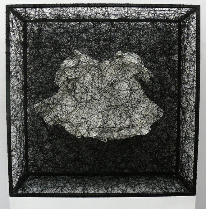 Chiharu Shiota, State of Being (Children's dress), 2012, robe, peinture, métal et fil noir, 90 x 90 x 35 cm. Photo © Marika Prévosto, Art Paris 2012